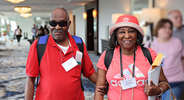 Cleveland and Ernestine, members of the NFB of North Carolina,  smile for a photo at national convention.