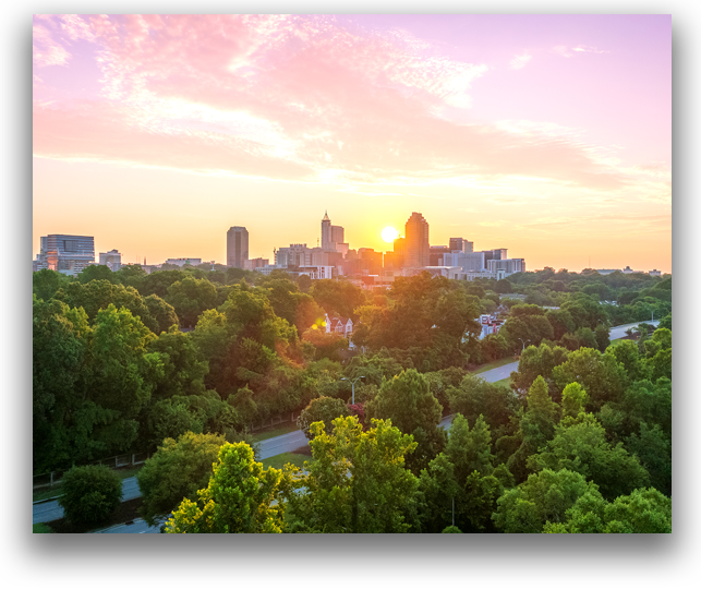 Skyline view of the city of Raleigh at sunrise.